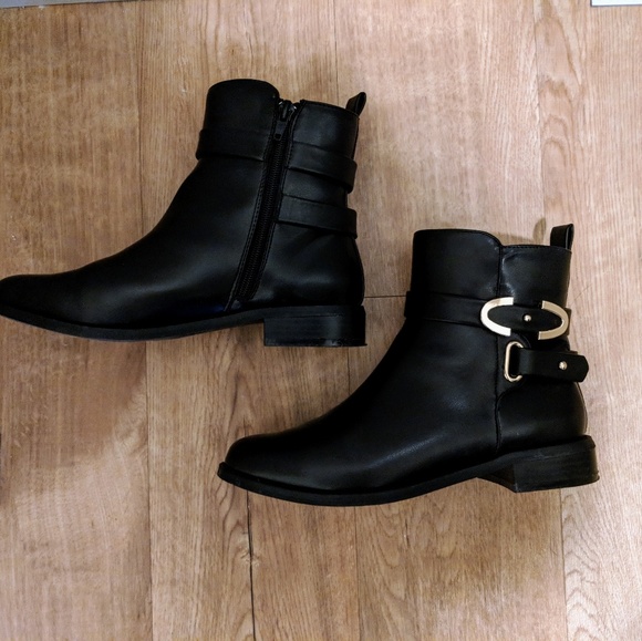 Shoes - Black ankle boots with gold embellishment.
